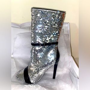 Cape Robbin with silver sequins and black detail. Brand new with the box.